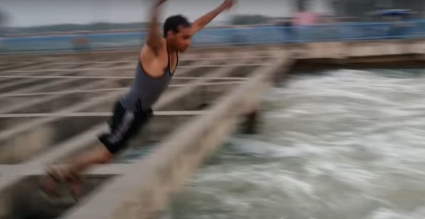 boys diving in ganga canal